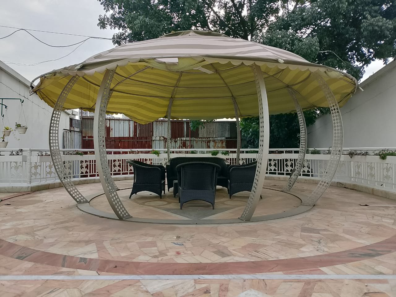 The garden gazebo seating beside the lawn